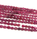 Natural pink sapphire faceted oval beads strand showing sparkling faceted gemstone beads
