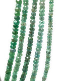 Close up of Zambian Emerald beads showing natural green gemstone color