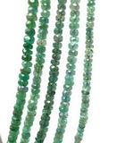 Close up of Zambian Emerald beads showing natural green gemstone color