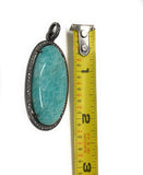 Detailed view of Amazonite Pendant next to measuring tape to show the length of the Pendant.