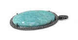 Side view of Amazonite Gemstone Pendant showing the detailed pattern and  the color of the gemstone as well as showing details of the metal and diamonds .