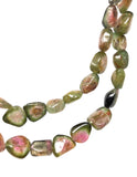 Macro texture of natural watermelon tourmaline beads highlighting faceting, polish, and premium AAA gemstone quality