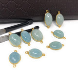 Aquamarine connectors image showing the flat gemstone surface and bezel construction