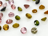 Natural loose faceted tourmaline gemstones in assorted colors, precision cut stones for custom jewelry making and gemstone collections.