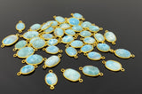 Natural Larimar gemstone connectors displayed on black background for premium jewelry making supplies