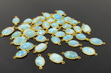 Natural Larimar gemstone connectors displayed on black background for premium jewelry making supplies