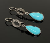 Sleeping Beauty Turquoise Diamond Earrings, Genuine Pavé Diamond Dangle Earrings in Sterling Silver with Black Rhodium Finish on Black Background.