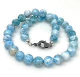 Natural blue Larimar beaded necklace with pave diamond clasp shown on white background