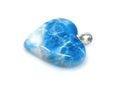 Side view of larimar heart pendant showing polished 925 sterling silver craftsmanshipand blue color and pattern