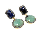 Side view of natural gemstone dangle earrings showing dimensional emerald, sapphire and diamond setting.