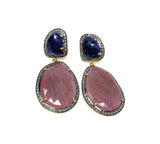 Blue and salmon sapphire diamond earrings on white background showing natural gemstone detail with sterling silver setting