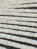 Sixteen-inch strand of milky white Rainbow Moonstone square heishi beads with subtle blue flash