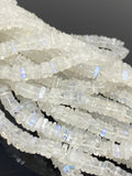 Close-up of smooth square Rainbow Moonstone beads showing natural translucency and blue reflections