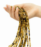 Petro tourmaline brick beads on hand showing bead size range for gemstone jewelry making