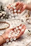 White moonstone beads held in hand showing bead size and natural gemstone texture for jewelry making