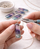 Fluorite gemstone charms used in jewelry making showing lightweight crystalbeing made into a necklace