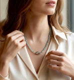 Luxury blue green tourmaline necklace worn by woman