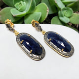 Blue sapphire birthstone earrings with sparkling diamond details