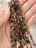Natural Tourmaline side drilled stick beads for jewelry making shown on hand