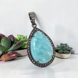 One of a kind Larimar pendant handcrafted in sterling silver with pave diamond accents
