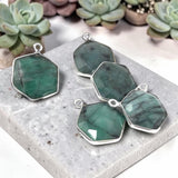 Close up of natural Emerald gemstone charms with green color