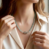 Blue green Indicolite Tourmaline beaded necklace worn by elegant woman