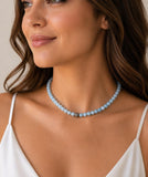 Woman wearing Aquamarine beaded necklace with pave diamond clasp and pave diamond bead.