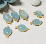 Oval pale blue Aquamarine connectors in gold-plated sterling silver bezels with loops at both ends