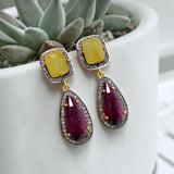 Ruby and yellow sapphire earrings measuring approximately 1.75 inches long and 0.55 inch wide