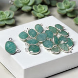 Group of blue-green Amazonite connectors in sterling silver bezels with two attachment loops