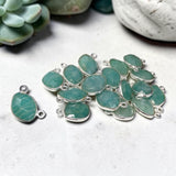 Group of blue-green Amazonite connectors in sterling silver bezels with two attachment loops