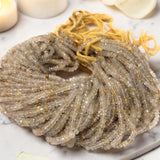 Lot of Golden Rutilated Quartz bead strands coiled in a circular shape