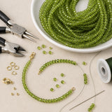 Elegant handmade jewelry being created using premium natural Peridot gemstone beads.