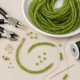 Elegant handmade jewelry being created using premium natural Peridot gemstone beads.