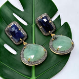 Natural emerald sapphire gemstone earrings featuring approximately 1.29 carats of genuine pavé diamonds.