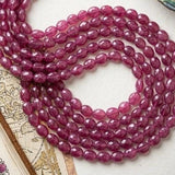 Faceted Pink Sapphire gemstone beads with organic shapes and center-drilled holes for stringing