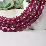 Thirteen-inch strand of natural faceted Pink Sapphire oval beads in deep rose and raspberry tones