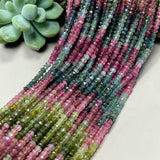 Macro view of genuine Tourmaline beads highlighting natural color variation and gemstone clarity.