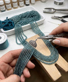 Natural Blue Tourmaline Indicolite gemstone beads being handcrafted into luxury jewelry by a professional jewelry designer.