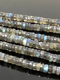 Macro view of natural Labradorite faceted heishi gemstone beads