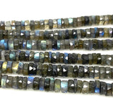 Close up of natural Labradorite faceted heishi gemstone beads on white background