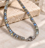 17.5 inch natural Labradorite beaded necklace with genuine pave diamond clasp displayed on neutral stone background