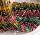 Close-up of natural Watermelon Tourmaline Heishi beads showing faceted tyre cut and pink green multicolor gemstone variations