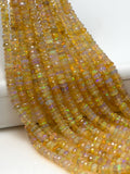 Natural faceted Ethiopian opal rondelle beads 3.5–4.5mm with rainbow color flashes