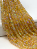 Natural faceted Ethiopian opal rondelle beads 3.5–4.5mm with rainbow color flashes