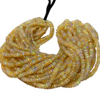 Faceted Ethiopian opal rondelle beads showing multicolor fire and natural gemstone variations